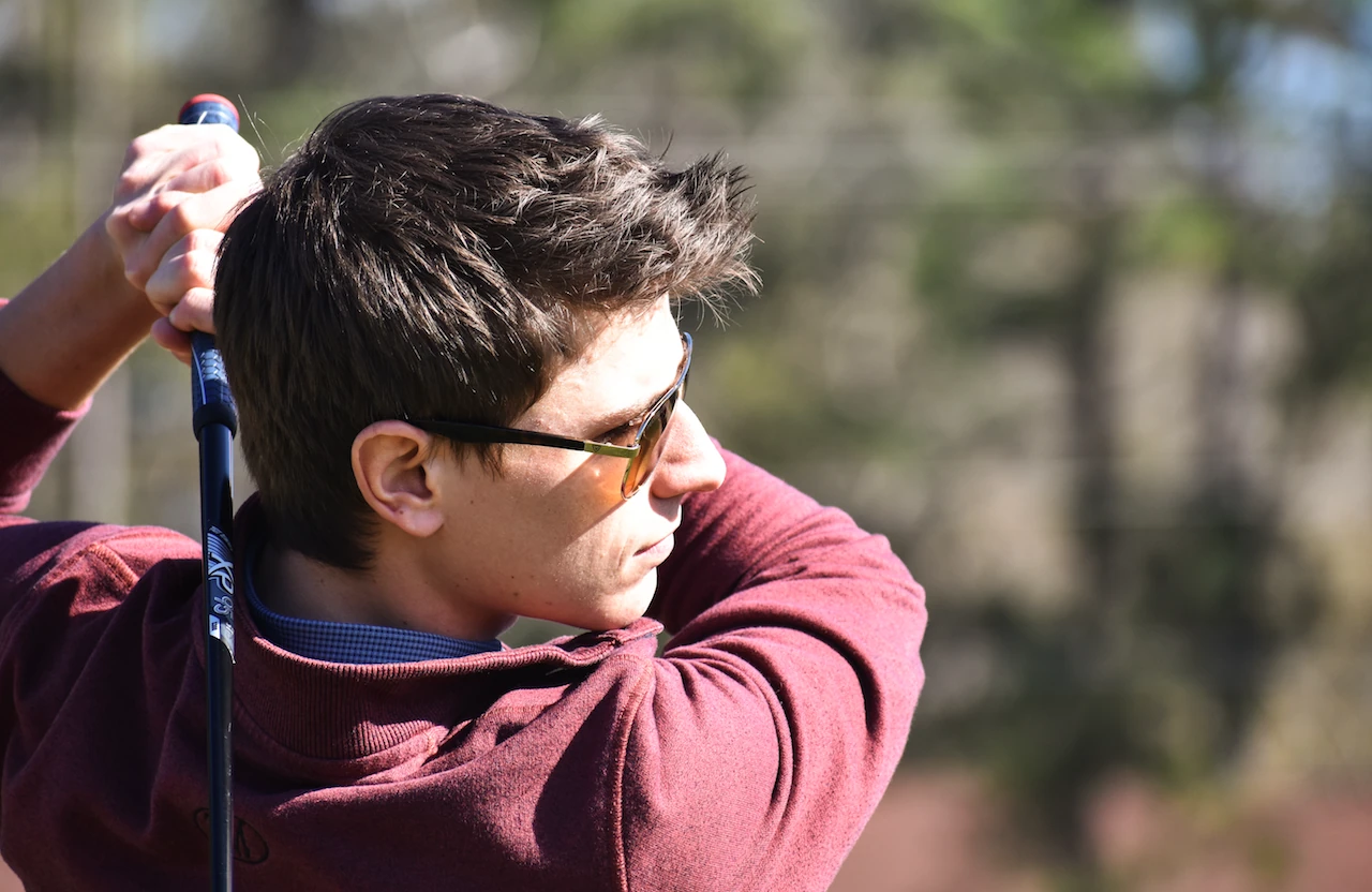 Golfer wearing PeakVision sunglasses during a swing — supplied PeakVision photograph