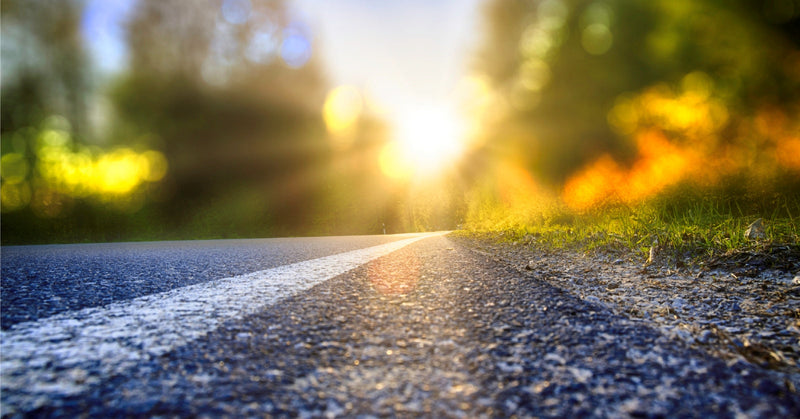 sun glare pov from cyclist lane on road