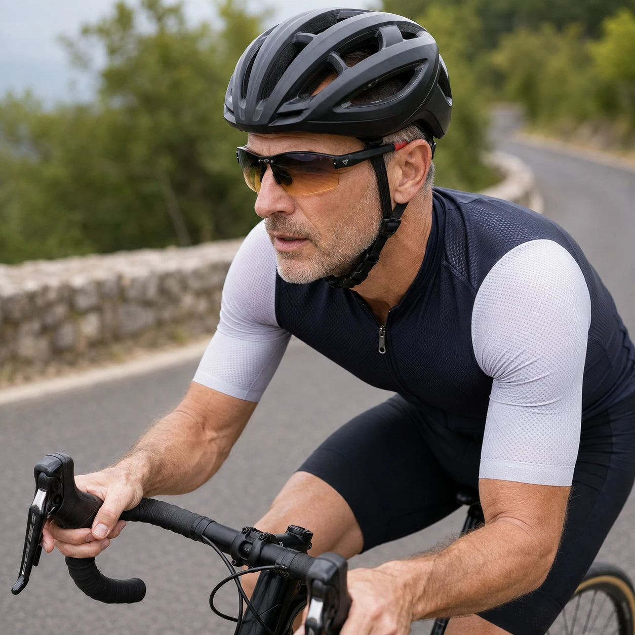 Biking activity featuring PeakVision GX6 sunglasses with silver temple emblem